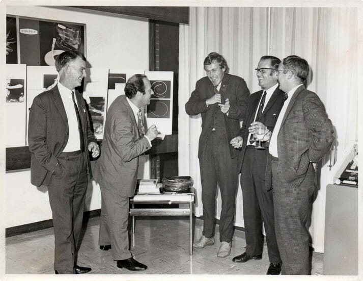 FIGURE (2) John Periam (centre) shares a story with vets on a visit to the Portex headquarters in Kent