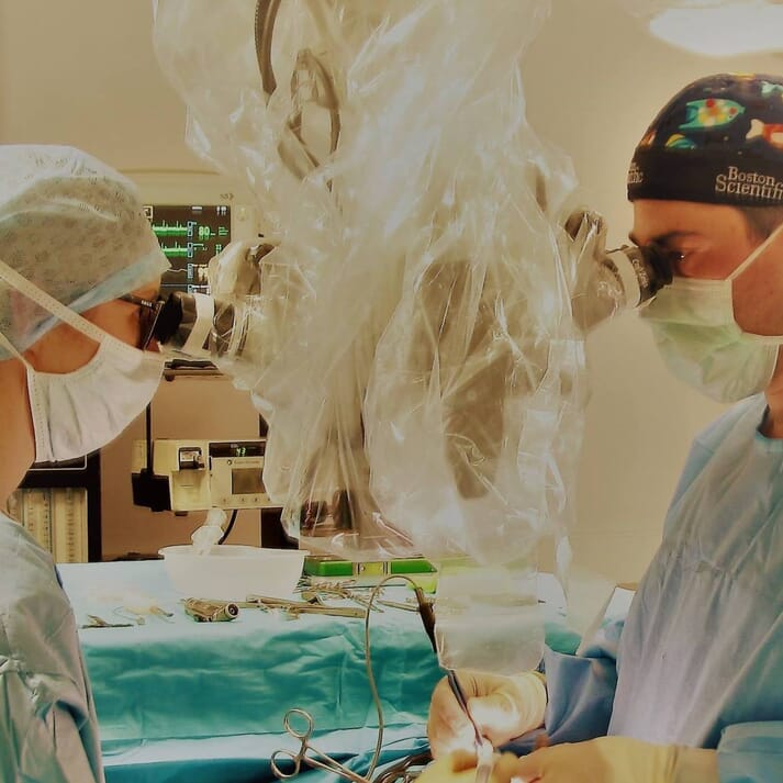 FIGURE 2 It is possible for two users to have a normal posture during the procedure and to work in the same small surgical approach without interference of delicate structures, such as spinal vessels and the spinal cord
